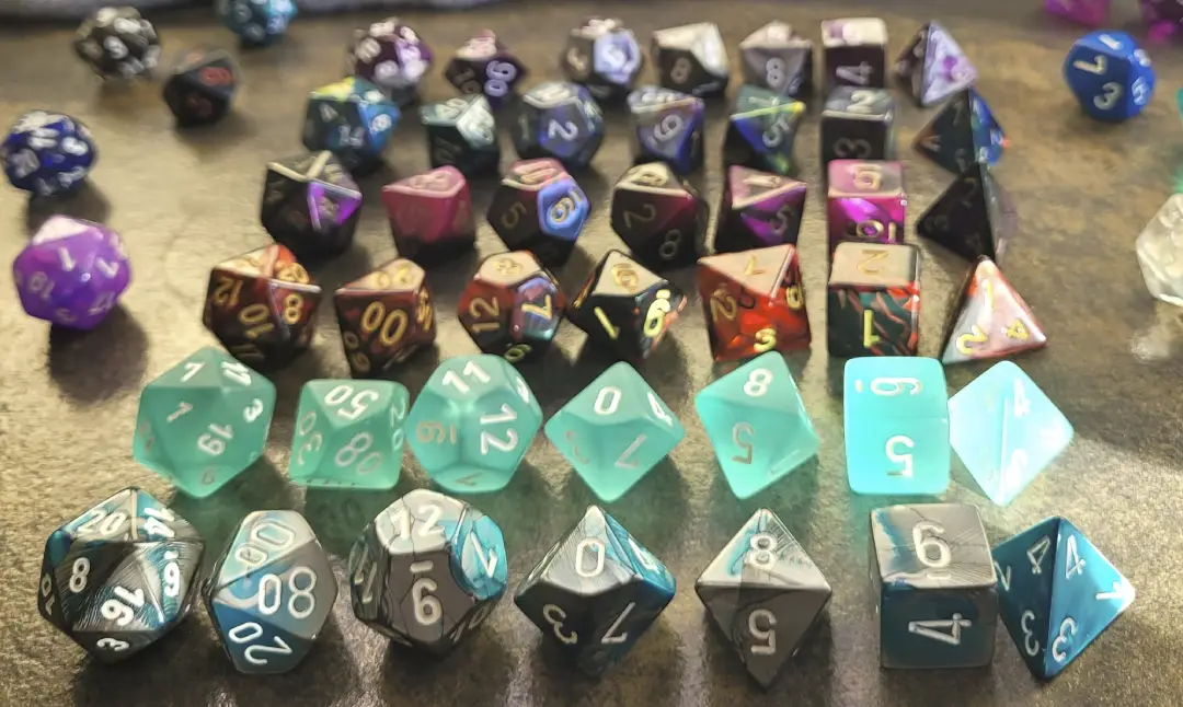 Full sets of plastic polyhedral dice included with tealight packs